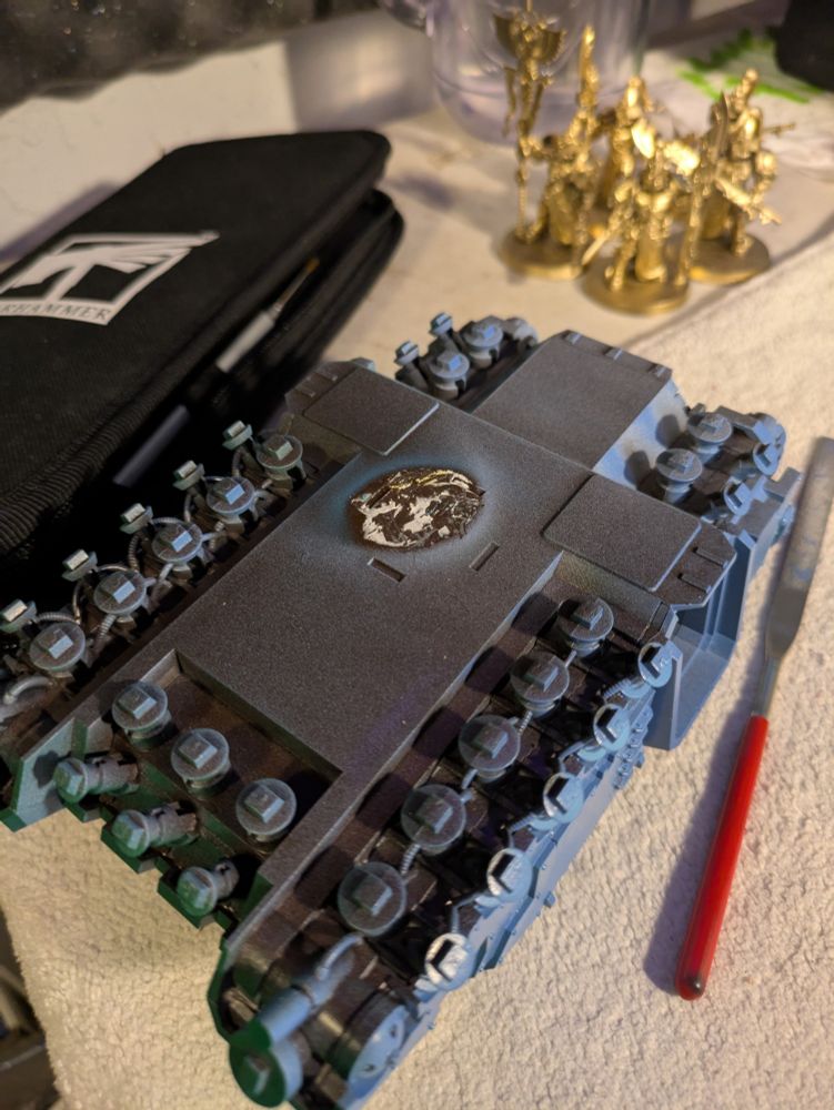 sticky tack residue on the underside of a miniature vehicle 