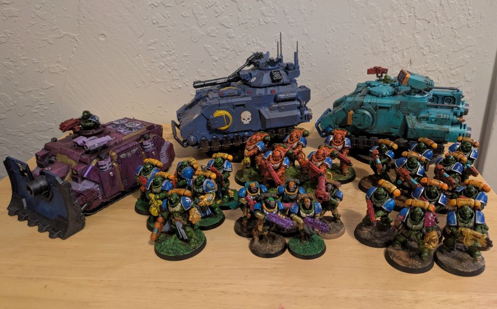 A 1,000 point Space Marine Army. Vindicator, Gladiator Lancer, Impulsor all along the back. In front of them are a Captain with 5 Sternguard Veterans, 5 Heavy Intercessors, 5 Scouts, 5 Hellblasters, and 5 Intercessors.