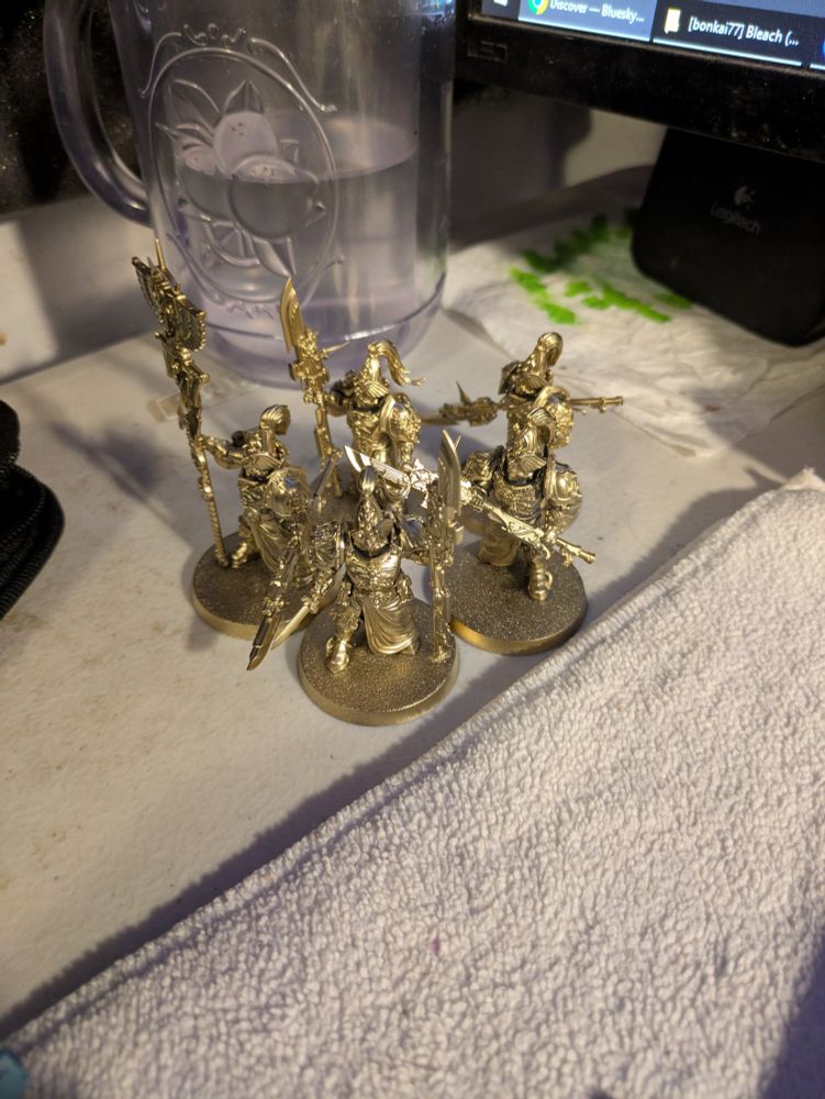 5 custodian wardens, primed in gold spray paint.