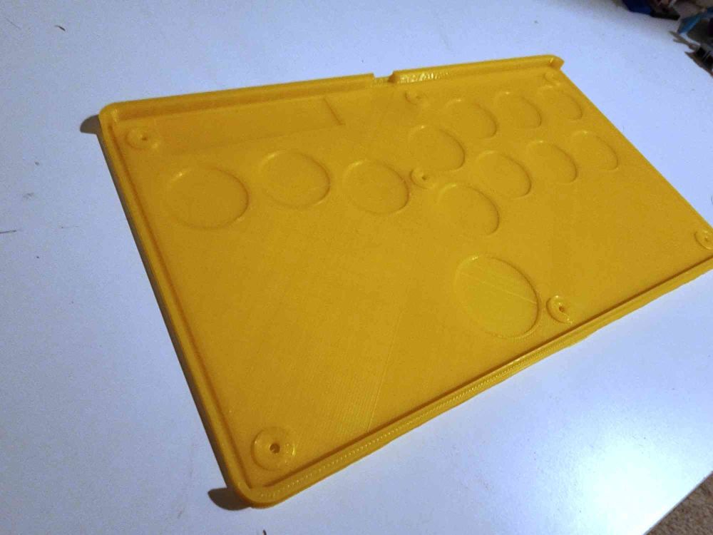 Yellow bottom half 3d printed plastic of a stickless fight stick