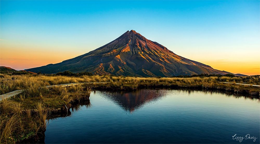 View of Mount Taranaki from the Pouakai Ranges at sunset in New Zealand. Photo by Lizzy Davis.