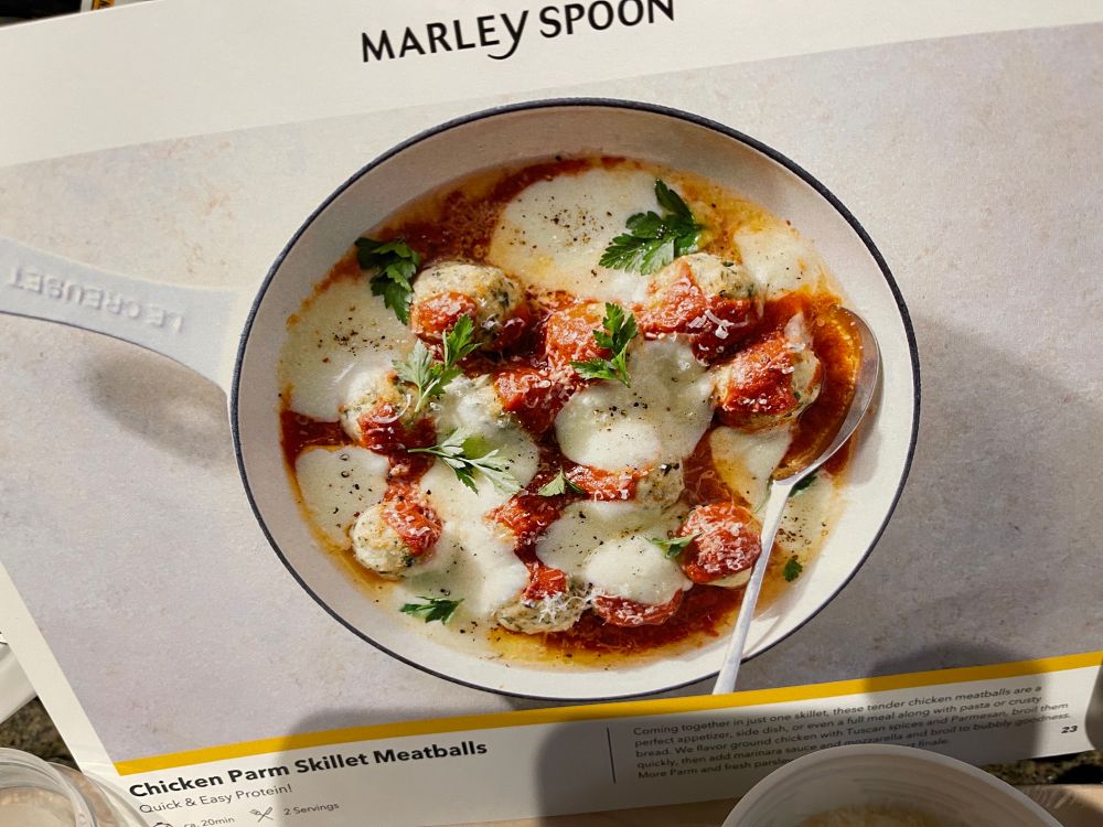 A recipe card showing Chicken meatballs in a pan with marinara sauce