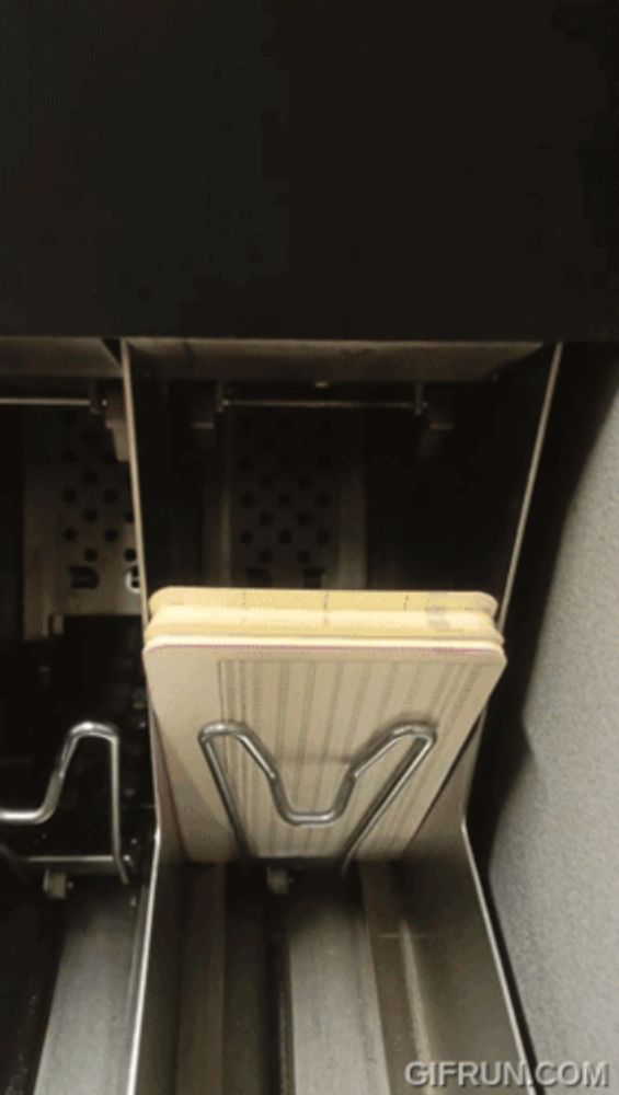 a gif from gifrun.com shows a cutting board in a holder