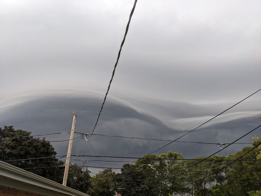 A cloud with a distinct swoopy wave front