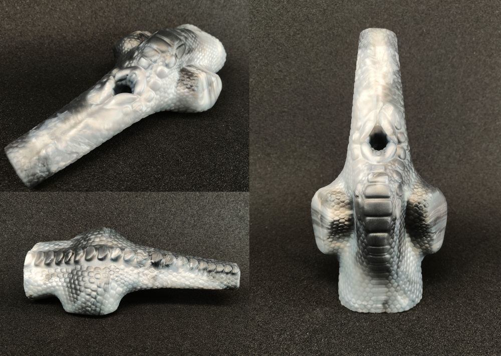 A sex toy in the shape of the back end of a raptor, complete with tail and scales!