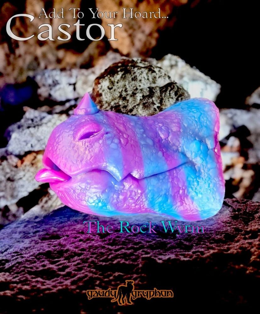 A penetrable sex toy, sculpted to look like a one-horned wyrm maw complete with a peeking tongue.