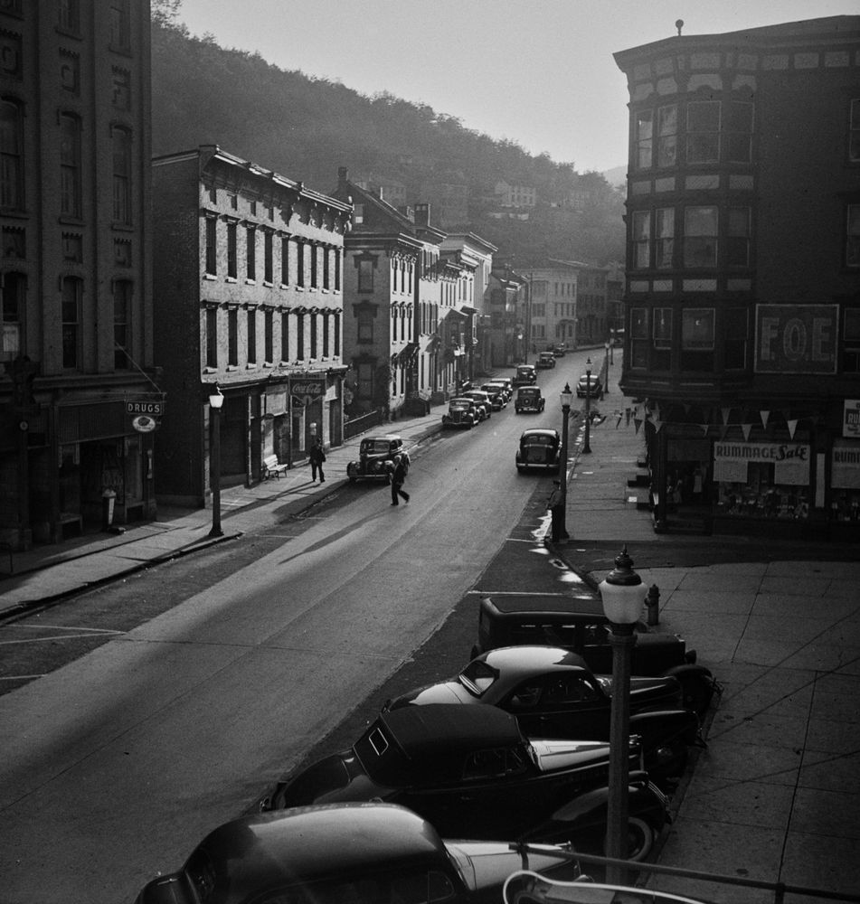 Jack Delano visited Mauch Chunk, in northeastern Pennsylvania, in August 1940, producing more than 120 negatives. The photograph shows one of the main streets in the town, captured in beautiful light with a large selection of parked vehicles. A building on the right side is labeled F.O.E,, for Fraternal Order of Eagles. The coal-mining and railroad town of Mauch Chunk was renamed Jim Thorpe in 1954 in honor of the native American athlete who was interred there the same year.