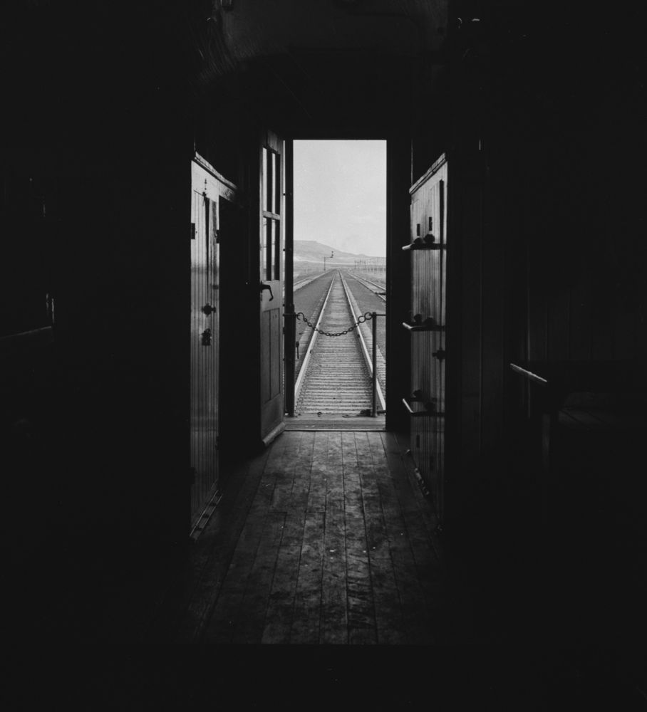 Vanishing point: Framed in darkness, Jack Delano’s photograph shows the view out the back of a caboose on the Atchison, Topeka & Santa Fe Railroad between Belen and Gallup, New Mexico. Delano rode the rails in the state in March 1943 to document the railroad’s operations in support of the war effort. The FSA/OWI records note that “This image (was) in a jacket marked ‘Killed.’"