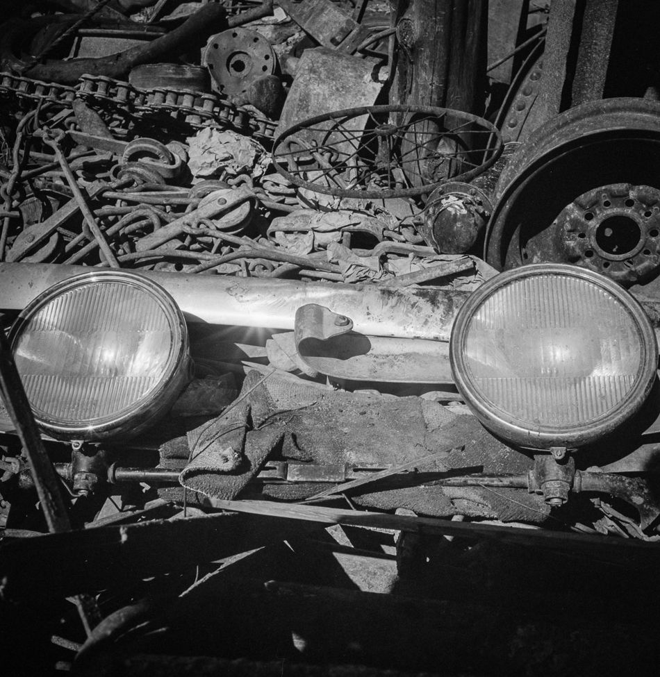 Scrap for the war: Marjory Collins photographed a pile of scrap metal collected for recycling for the war effort at a collection site in Washington, D.C., in May 1942. Piled near a heavy-duty chain and other industrial scrap, a bumper and set of auto headlights dominate the foreground.
