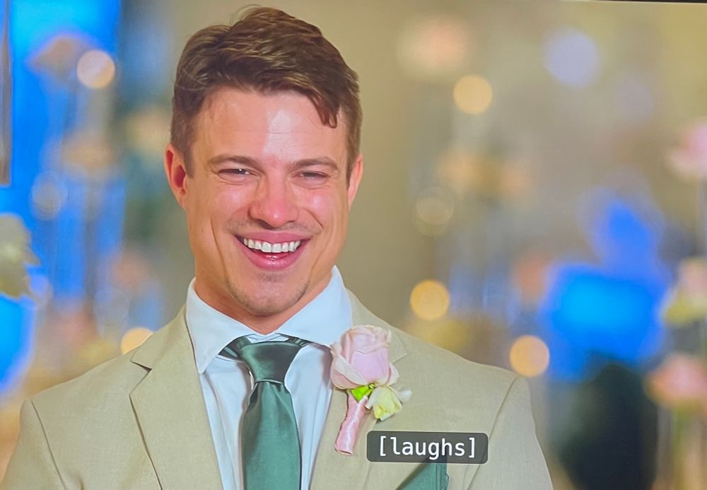 Guy chuckling about sad things.