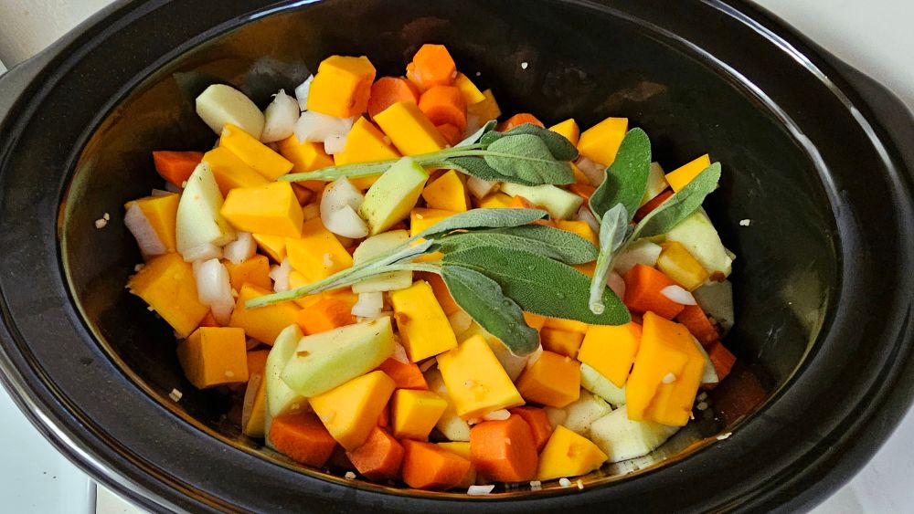 Butternut squash soup before coming. Chopped onion, some, carrots, and squash with garlic, sage, and vegetable stock.