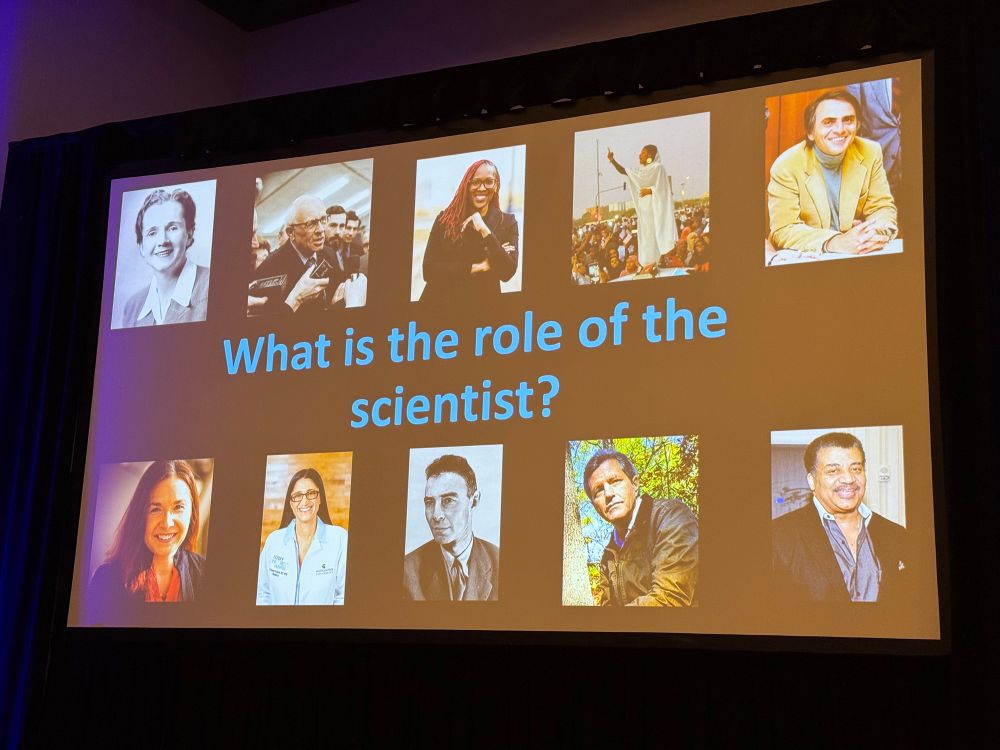 Photograph of slide asking "what is the role of the scientist?"