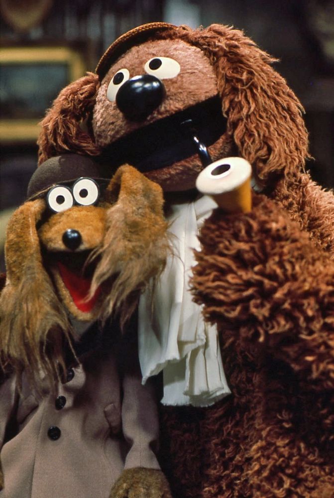 baskerville the hound and rowlf the dog dressed as holmes and watson, or possibly they're both holmes 