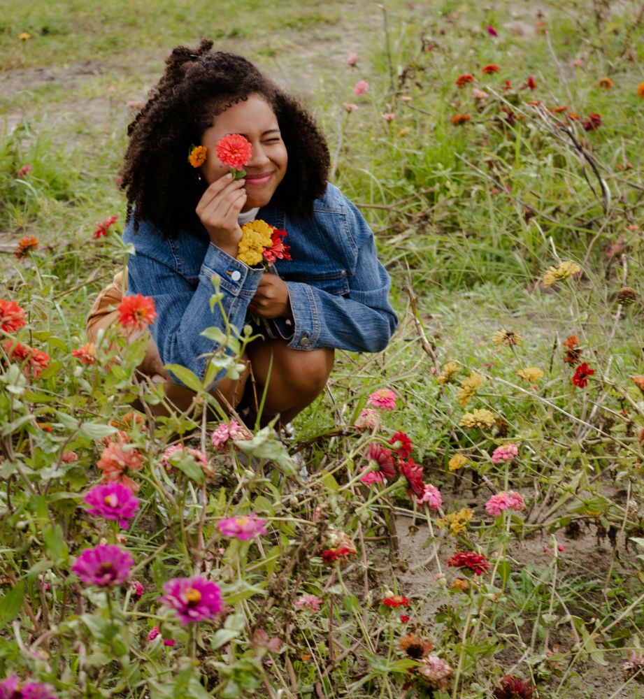 Person In A Field Of Flowers Holding Flowers
Photo By Monica Griffin Via Pexels