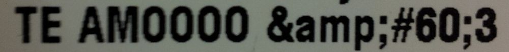 Printed note initially submitted to a web site.
"TE AMOOOO &amp;#60;3"
Because &amp; is an encoded "&".
And &#60; is an encoded "<"
And "<3" is an emoji for a heart.
