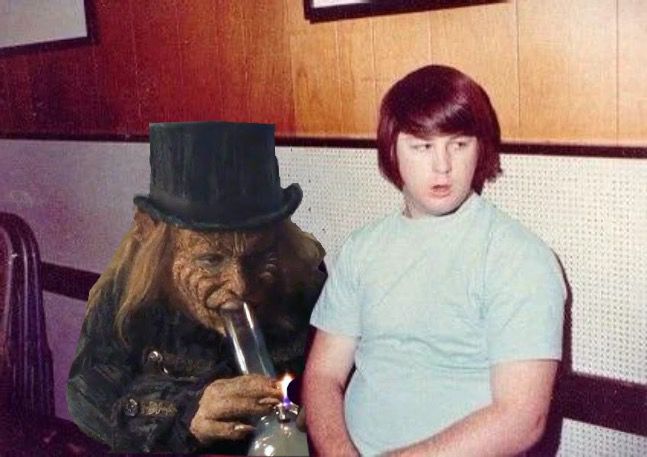 Brian Wilson looking away from the Leprechaun hitting his bong