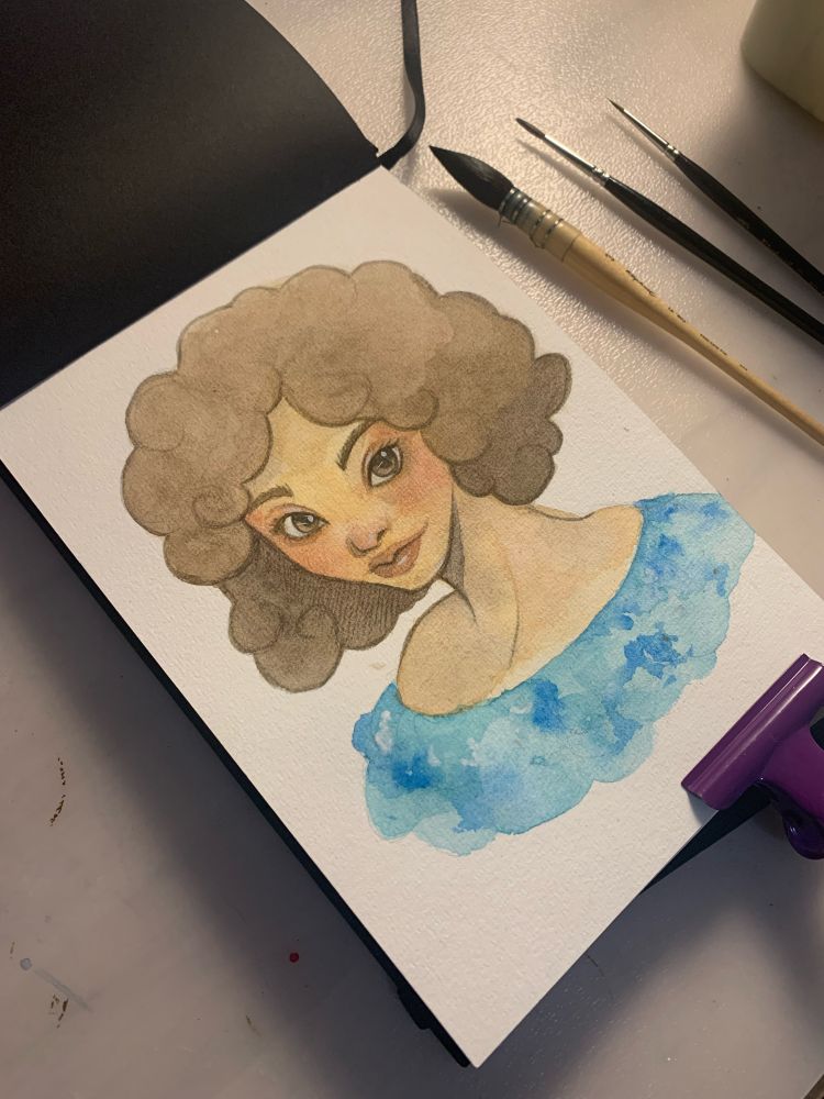 Portrait d’une femme métisse réalisée sur la première page d’un carnet