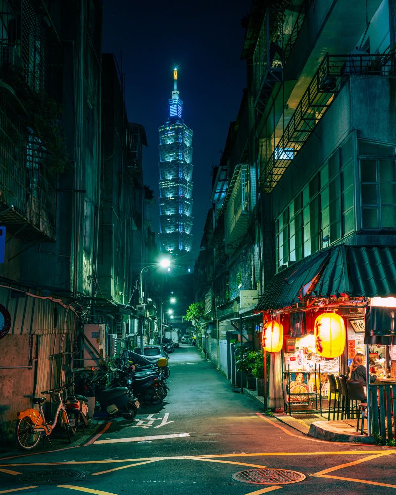 City shot in Taipei of 101 from an old alley with a Japanese restaurant on the corner