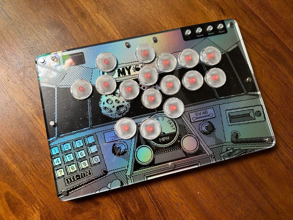 Haute42 T16 leverless controller with custom artwork, featuring the ship cockpit from Cosmic Osmo (1989). It's printed on a holographic paper, giving the background a fun metallic sheen.