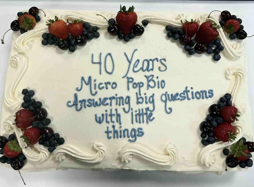 A celebratory cake at the 40th anniversary of the Gordon conference that says “ 40 years Micro Pop Bio Answering big questions with little things” . 