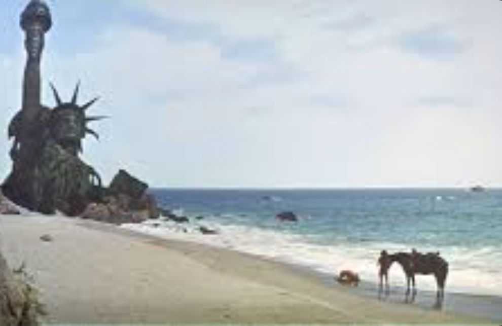 Planet of the Apes: statue of Liberty half buried in beach sand. 