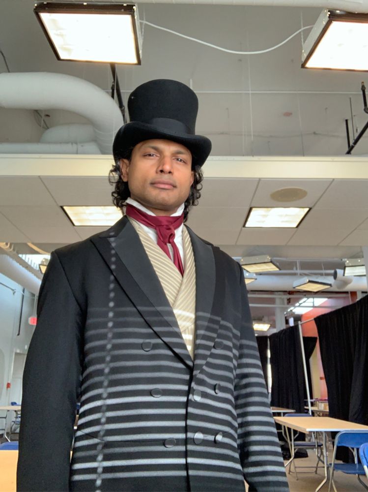Bhanu Gopal from Survivor 46 in a tophat 