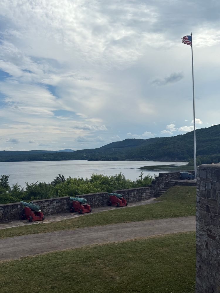 The American flag outside Fort Ticonderoga, Mount Defiance in the distance.