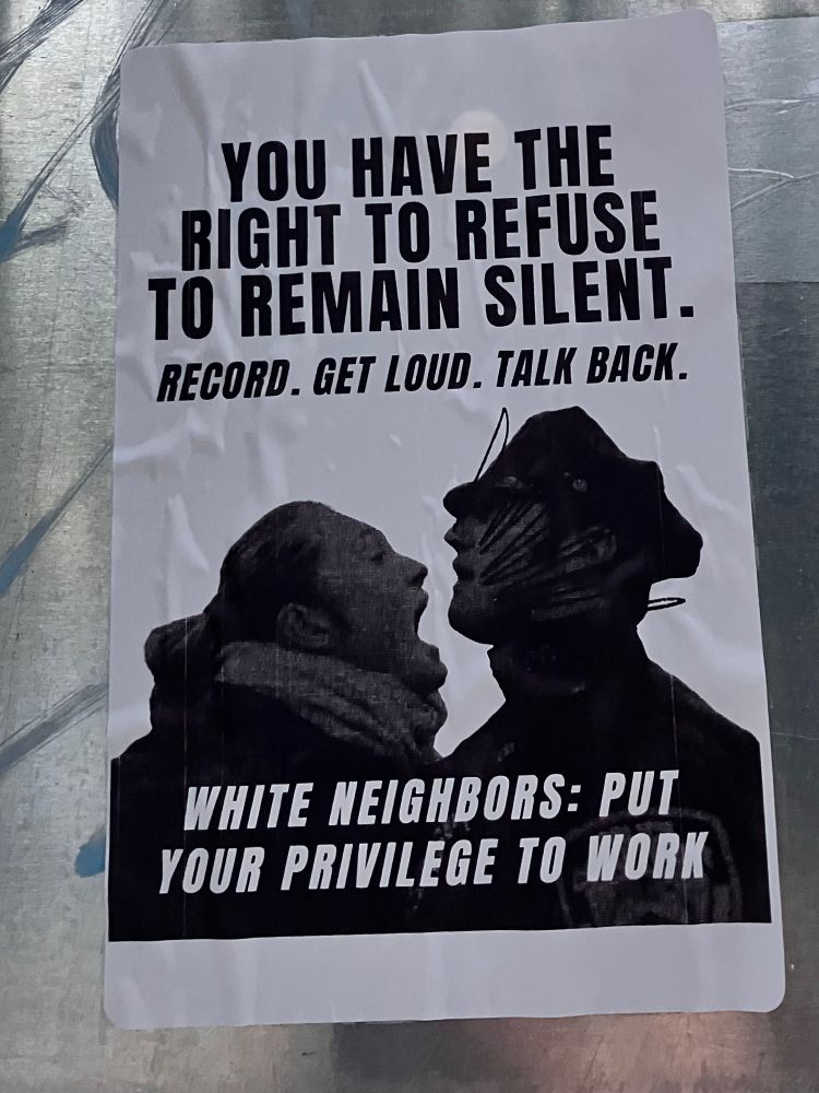 A sticker telling white people to use their privilege and speak up