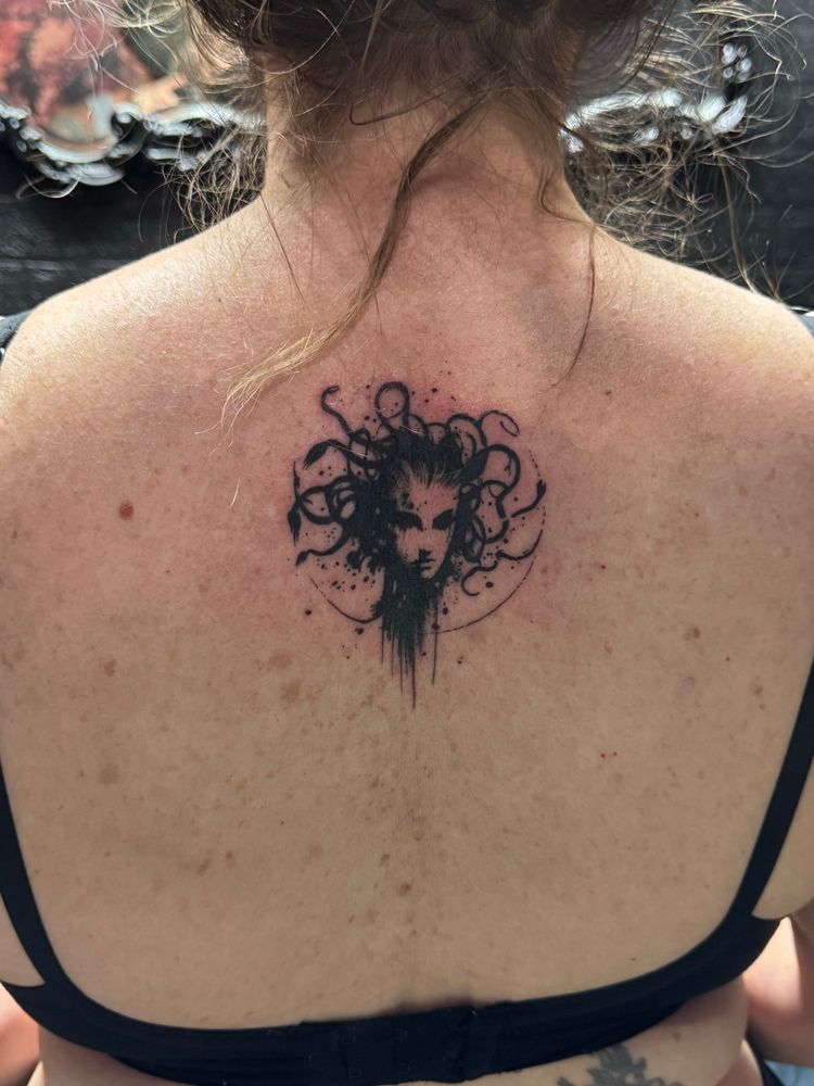 A back tattoo of Medusa 
