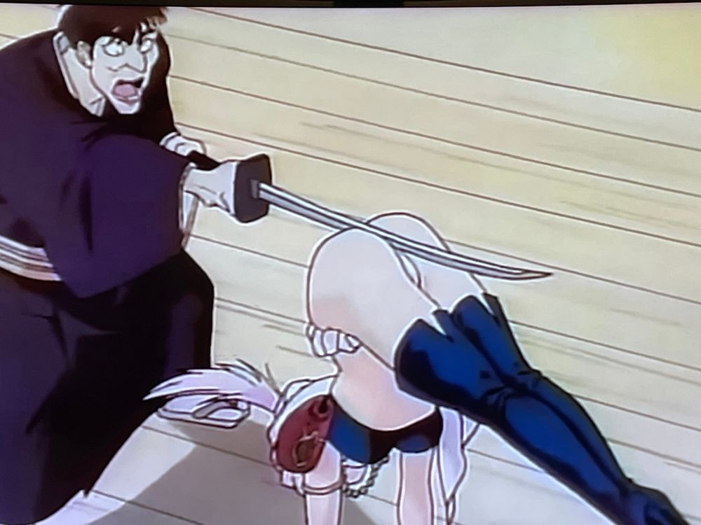 female anime character stops katana blade with ass cheeks. Samurai guy is dismayed. 