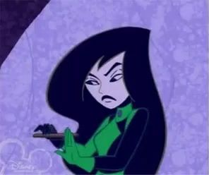 a cartoon character from kim possible is holding a gun in her hands .