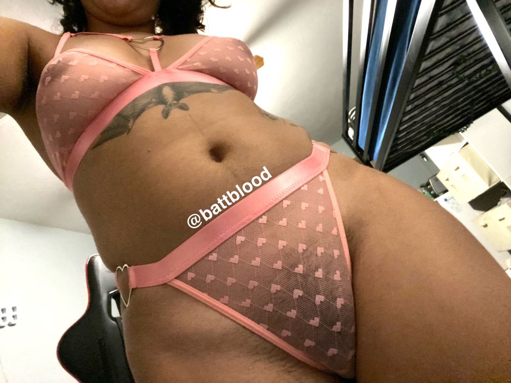 Batz is wearing a mesh baby pink lingerie set with pink heart details.