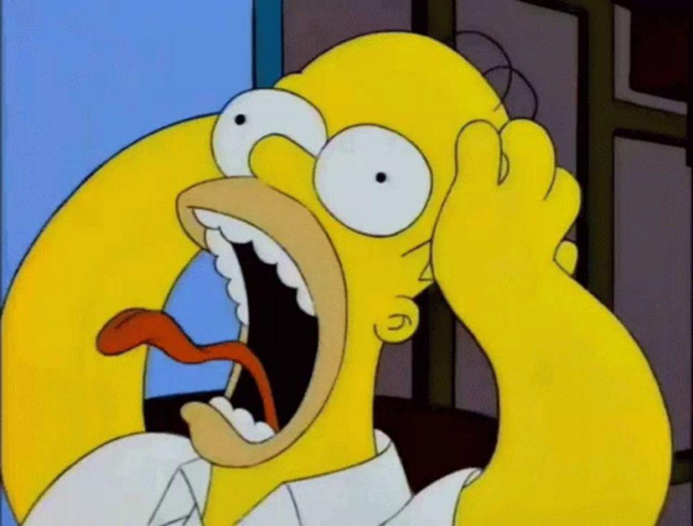 homer simpson with his mouth wide open and his tongue out