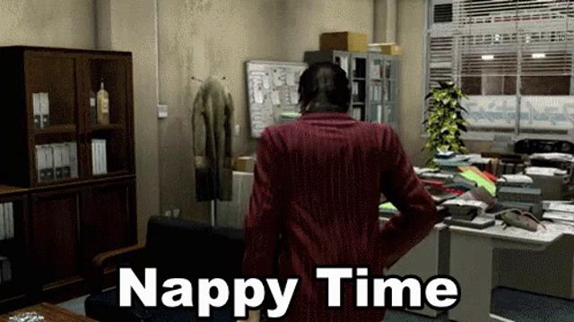 a man in a red jacket stands in an office with the words nappy time written on the bottom