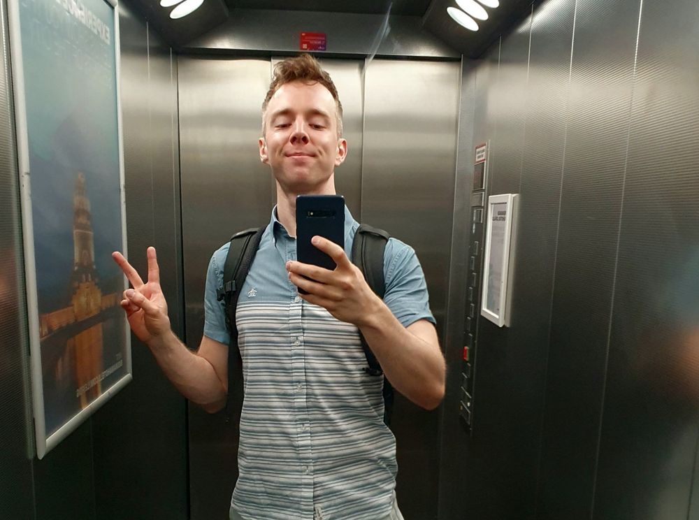 selfie in elevator doing peace sign
