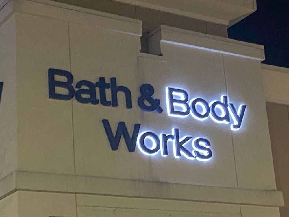A partially-lit sign, the lit section spelling “Body orks.”