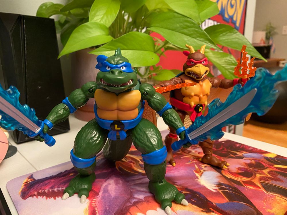 tmnt x godzilla action figures leo (godzilla) and raph (rodan) posing super cool! sunglasses emoji 