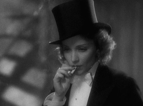 Okay so, it's Marlene Deitrich in tails and a top hat, and she's smoking a cigarette with great intensity.