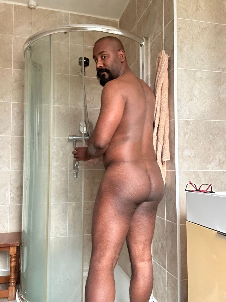 Danny Stroker going In to the shower showing his butt while looking back