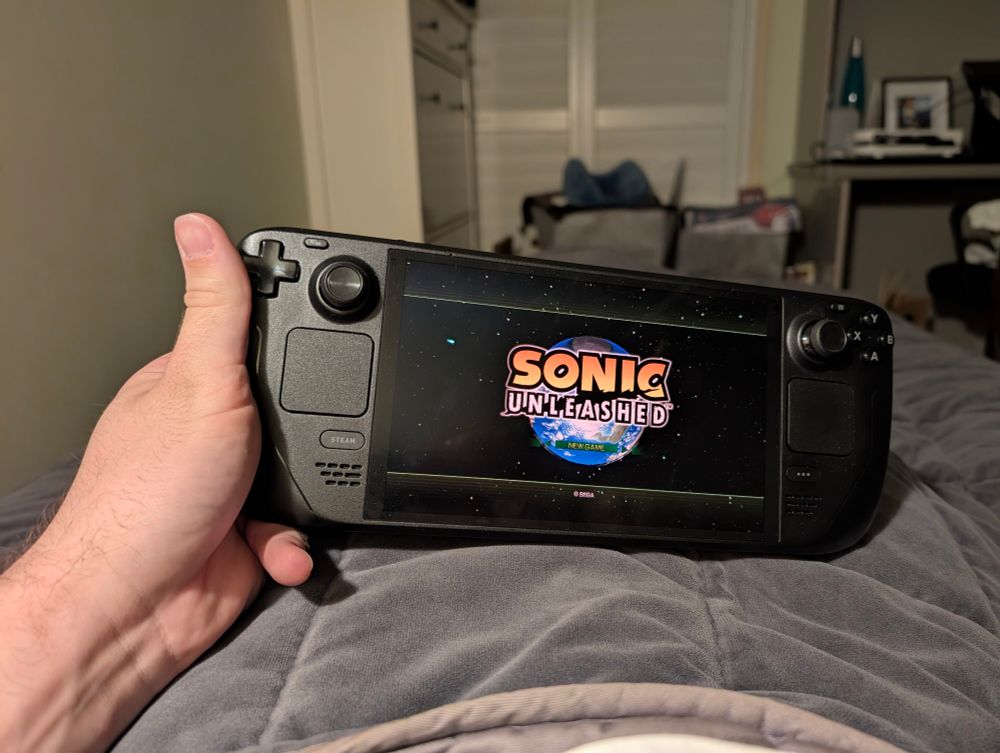 A picture of the game Sonic Unleashed being run on a Steam Deck while laying in bed