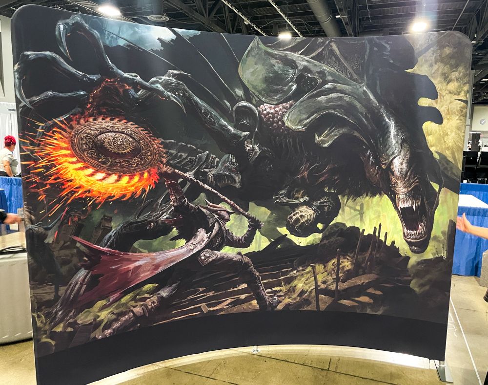 Life size banner of my alien vs bloodborne illustration to serve as a back drop for my table 