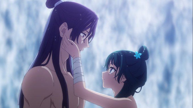 Maomaon and Jinshi stand opposite each other in the cave in front of the waterfall. He's barechested and she only has her apron on. The rest of their clothes are drying. So there's quite a bit of naked skin visible. Moamoa caresses Jinshi's cheek and he is blushing and watching her.