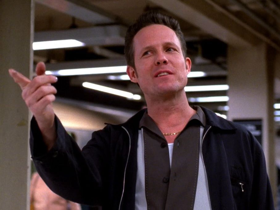 30 Rock’s Dennis Duffy, looking smug as ever and pointing at someone off screen.