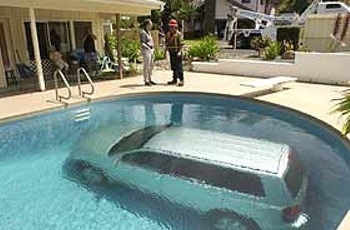 car in a pool. people are having a conversation near by