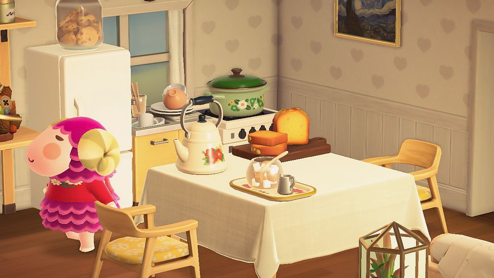 a screenshot of my kitchen in animal crossing new horizons ! stella is also in the picture ♡ it’s a very cozy home with some pumpkin bread on the table along with a kettle and a cream & sugar set ! the sink is a little cluttered and there’s a jar of cookies on top of the fridge (yummy 🍪)