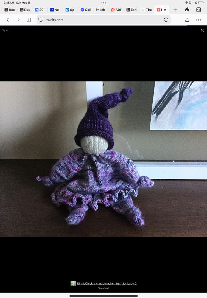 Knubbelinchen (pezi888 on ravelry for pattern) doll for a baby girl.

Purple knit doll sitting on a wooden mantle 
