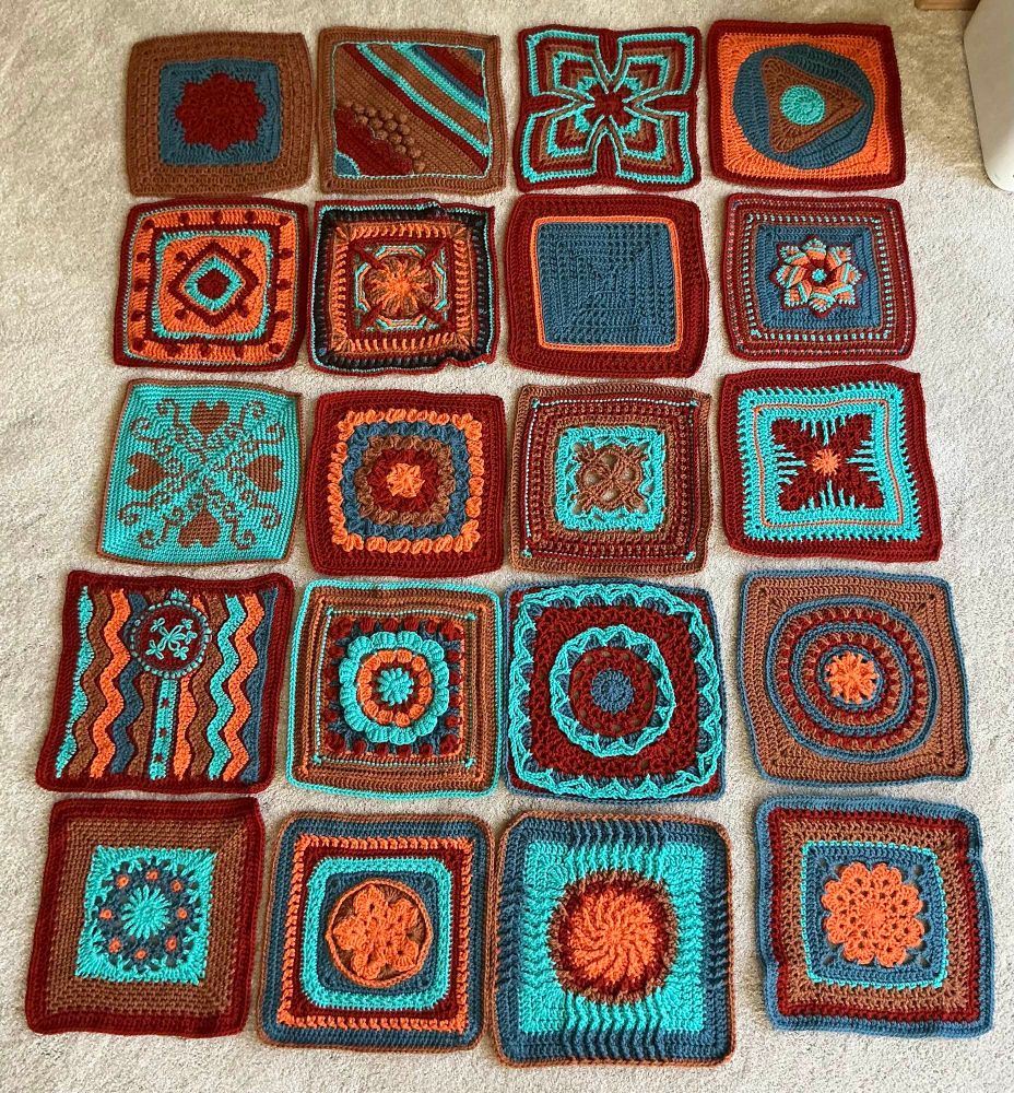 All of the blanket squares laid out in the floor.