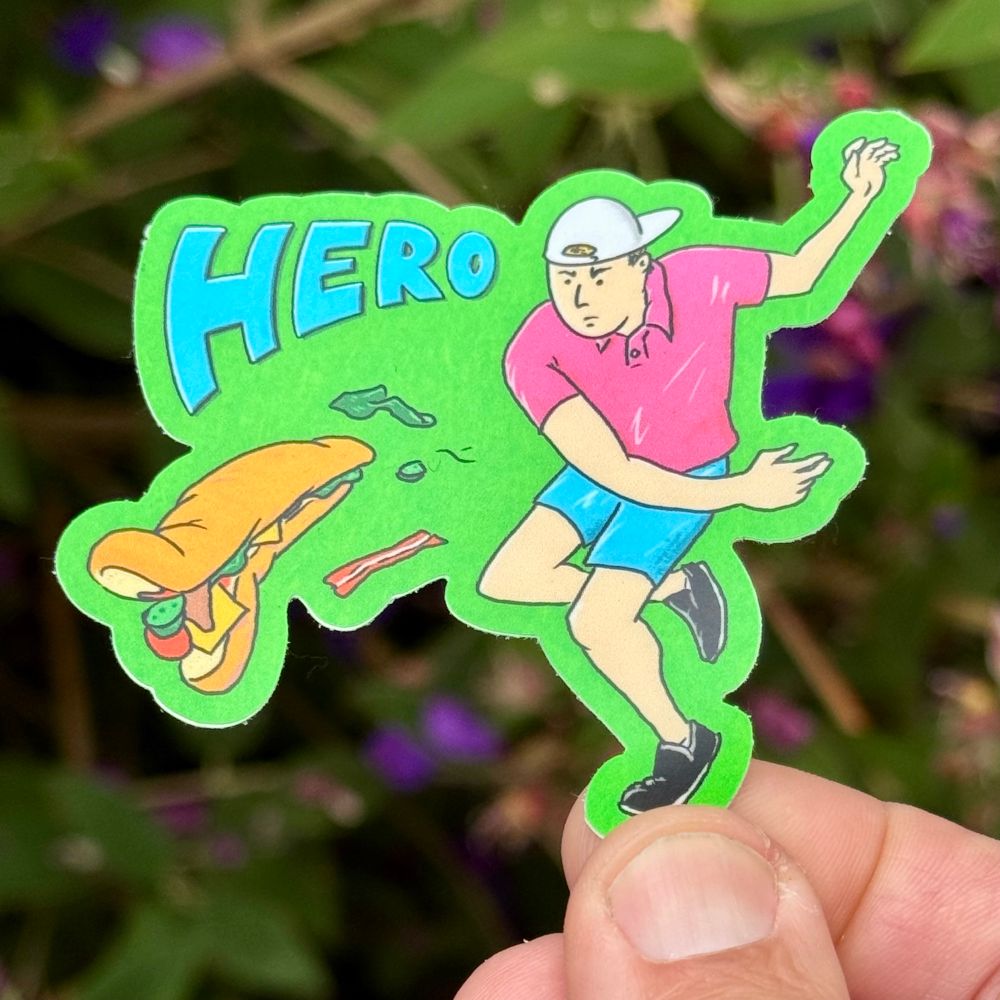 A sticker showing a drawing of a man in a pink polo shirt. He is dramatically throwing a subway sandwich. Text on the stickers says “Hero”. 