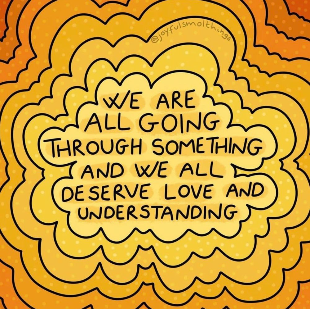 Illustration by @joyfulsmolthings with layered shades of yellow and orange forming a cloud-like border. In the centre, hand-lettered text reads: “We are all going through something and we all deserve love and understanding.”
