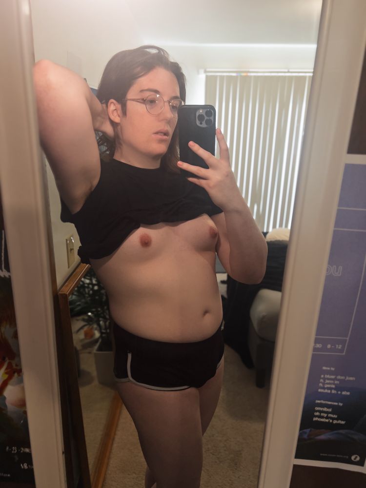 Lilith in the mirror with her tits out. 